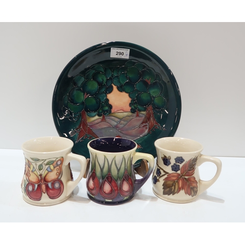 290 - A Moorcroft Mamoura pattern plate, 25.5cm diameter together with three Moorcroft mugs in Pink and Or... 