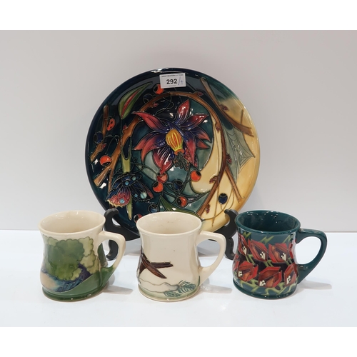 292 - A Moorcroft Hartgring pattern plate, 25.5cm diameter together with three Moorcroft mugs including Ro... 