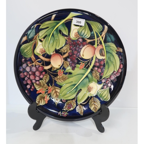 300 - A Moorcroft Queens Choice charger, designed by Emma Bossons, 35cm diameter