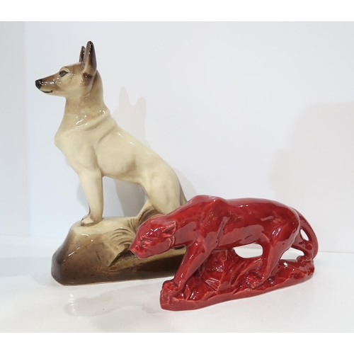 308 - A French pottery model of a lion, glazed red together with a seated pottery dog, after Francois Leva... 