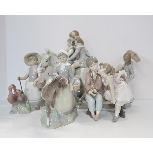 311 - A collection of Lladro figures including a girl with turkeys, a girl with a goat, children on a pony... 