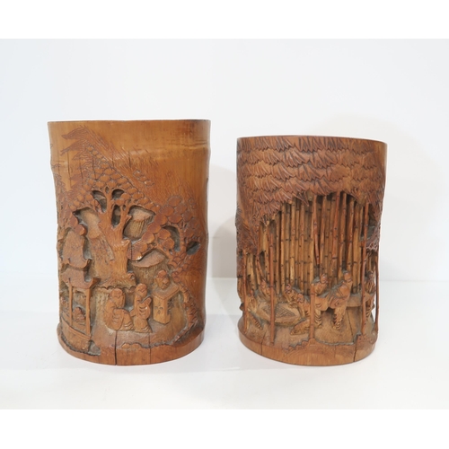 313 - Two carved bamboo brush pots, both decorated with scholars among forests and pavilions (2)