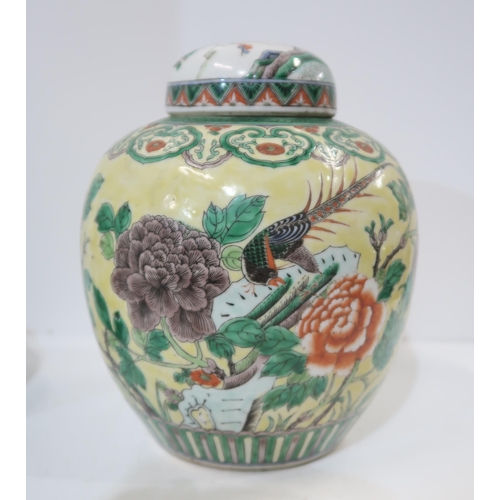 322 - A Chinese yellow-ground famille verte ginger jar, decorated with birds amongst rocks and flowers, wi... 