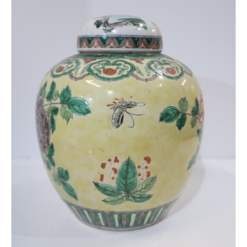 322 - A Chinese yellow-ground famille verte ginger jar, decorated with birds amongst rocks and flowers, wi... 