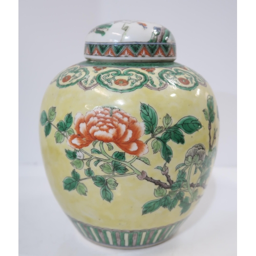 322 - A Chinese yellow-ground famille verte ginger jar, decorated with birds amongst rocks and flowers, wi... 