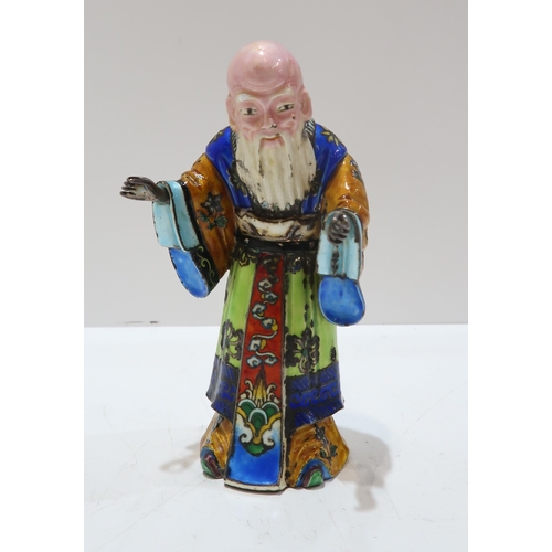 325A - A Chinese export silver and enamel figure of Shoulao, dressed in colourful enamels, with a removable... 