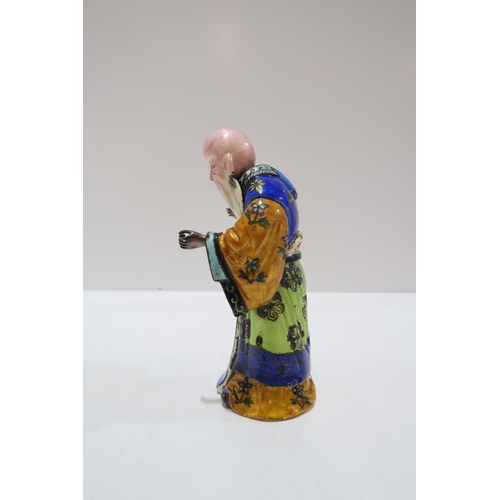 325A - A Chinese export silver and enamel figure of Shoulao, dressed in colourful enamels, with a removable... 