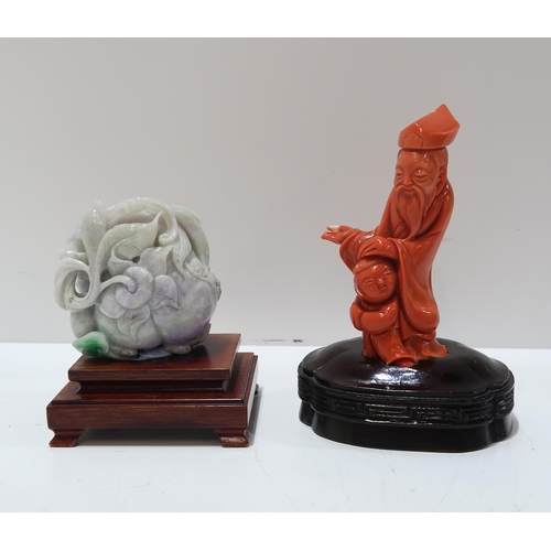 325B - A Chinese coral figure of a prophet and child, another green hardstone figure of a peach, a carved s... 