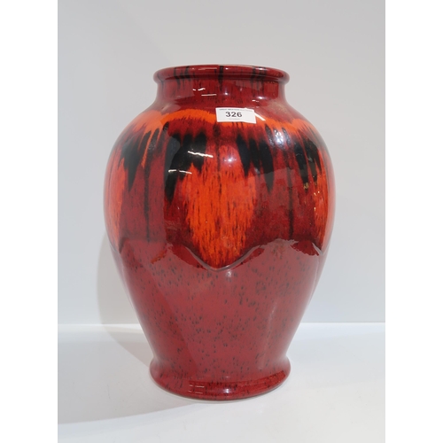 326 - A large Poole pottery vase in red, orange and black glazed with blue interior