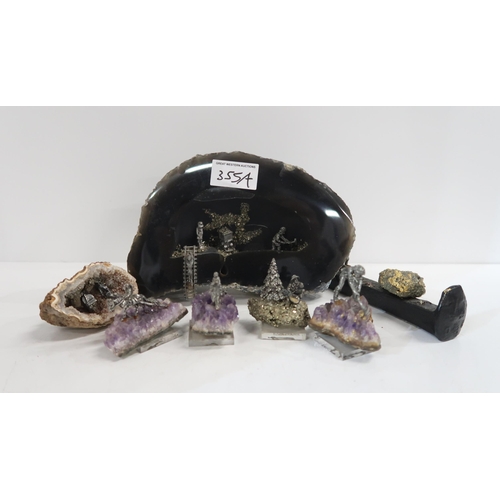 355A - A group of amethyst and Iron pyrites geodes set with metal mining figures etc