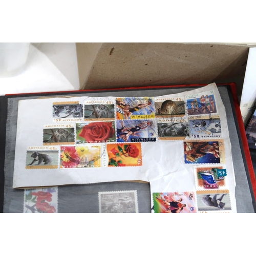 515 - A large box with assorted stamps with kiloware and mint. Further viewing recommended.