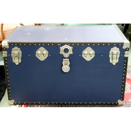 143 - A 20th century metal bound travel trunk, 52cm high x 92cm wide x 51cm deep