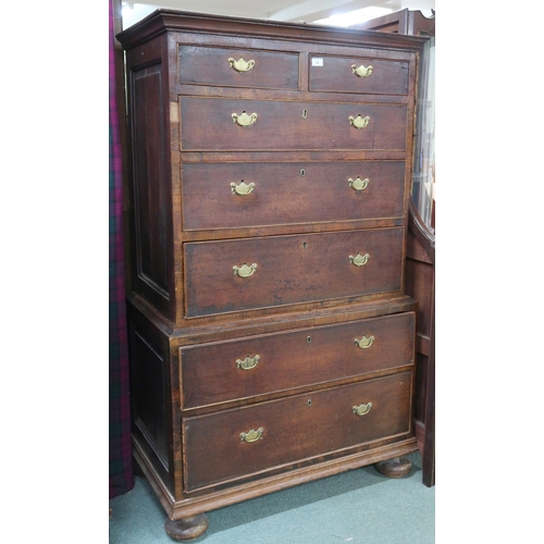 34 - A 19th century oak panelled sided chest on chest with moulded cornice over two short over three long... 