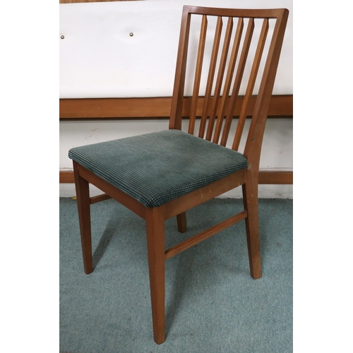 76 - A mid 20th century teak Vanson dining suite comprising extending dining table on shaped tapering sup... 