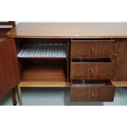 86 - A mid 20th century teak Vanson sideboard with three central drawers flanked by cabinet doors on shap... 