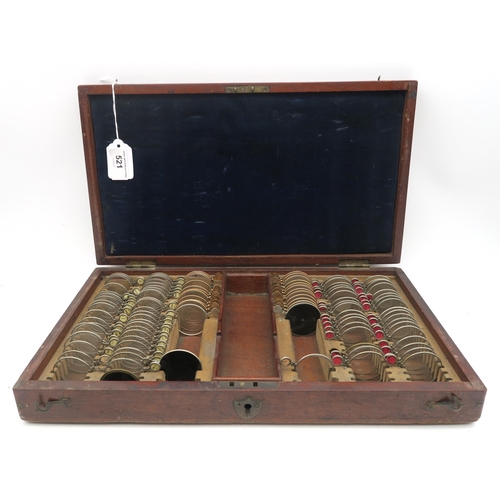 521 - A cased set of optometrist's lenses, measuring approx.39cm wide x 22cm deep