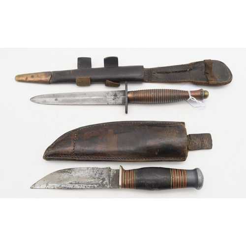 527 - A WW2 British Third Pattern Fairbairn-Sykes Commando fighting knife/dagger, housed in a metal-tipped... 