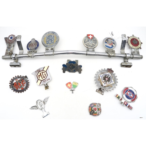 548 - A collection of enamel automotive grille badges, to include the Automobile Club de L'ile de France, ... 