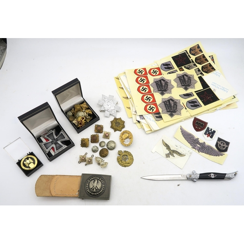 554 - A collection of replica WW2 German Third Reich items, comprising a small folding knife, large-scale ... 