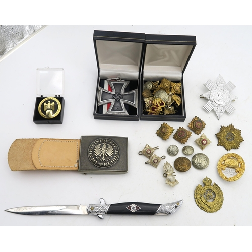 554 - A collection of replica WW2 German Third Reich items, comprising a small folding knife, large-scale ... 