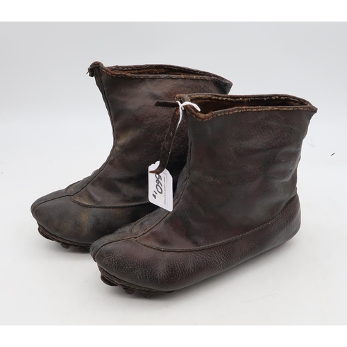 560 - A pair of leather boots with iron-studded soles, potentially of Chinese origin, together with a larg... 