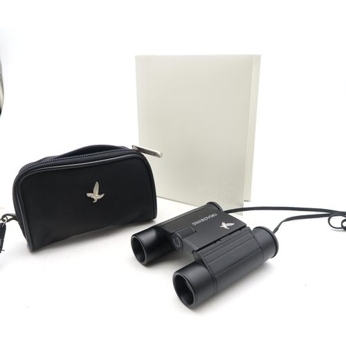 569 - A boxed pair of Swarovski Optik 8x10 binoculars, serial no. E790439294