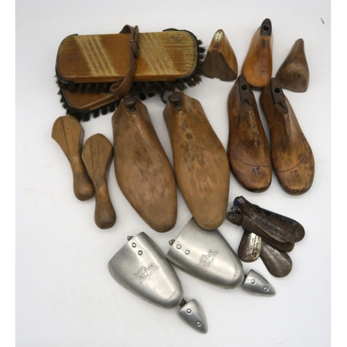 603 - A collection of wooden shoe lasts and a shoe shine kit with assorted brushes