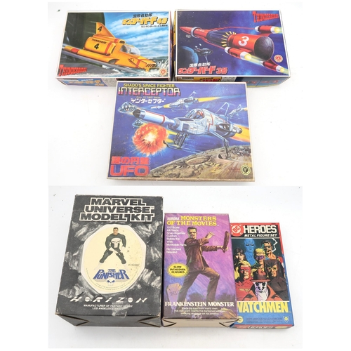 636 - A collection of vintage boxed model kits, comprising a DC Heroes Watchmen Metal Figure Set by Grenad... 