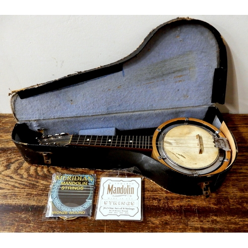 449 - A banjo mandolin with hard case and spare strings