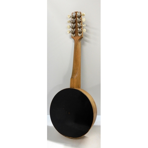 449 - A banjo mandolin with hard case and spare strings