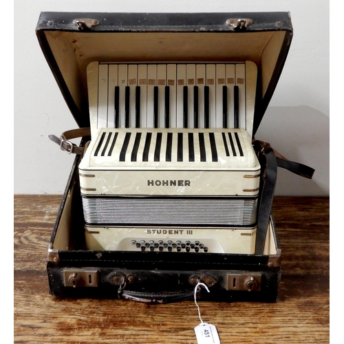 451 - A Hohner Student III 24 bass 25 key piano accordion in faux mother of pearl, with original case.