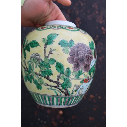 322 - A Chinese yellow-ground famille verte ginger jar, decorated with birds amongst rocks and flowers, wi... 