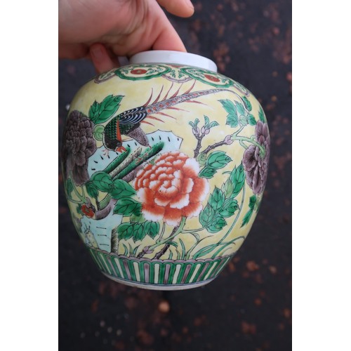 322 - A Chinese yellow-ground famille verte ginger jar, decorated with birds amongst rocks and flowers, wi... 