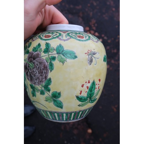 322 - A Chinese yellow-ground famille verte ginger jar, decorated with birds amongst rocks and flowers, wi... 