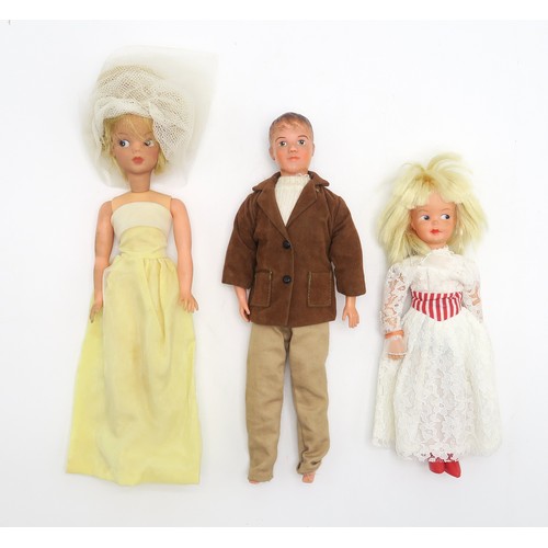 661 - Vintage Sindy, Paul and Patch dolls, with a range of costume accessories, many retaining their origi... 