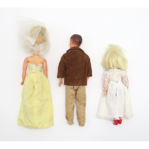 661 - Vintage Sindy, Paul and Patch dolls, with a range of costume accessories, many retaining their origi... 