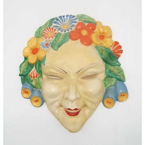 2160 - A CLARICE CLIFF FLORA WALL MASK circa 1936, relief moulded as a lady's face with floral hairband in ... 