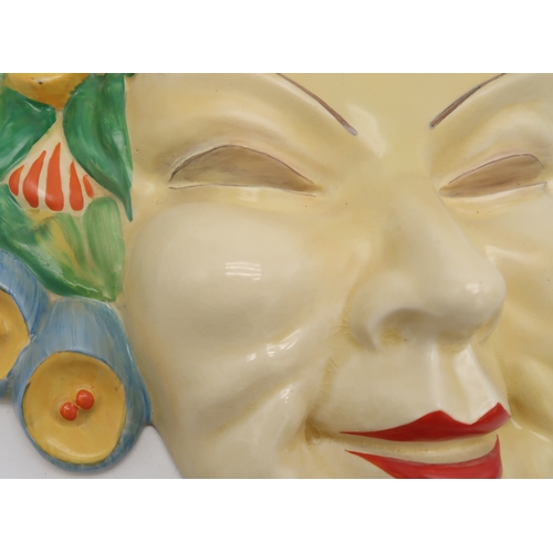 2160 - A CLARICE CLIFF FLORA WALL MASK circa 1936, relief moulded as a lady's face with floral hairband in ... 