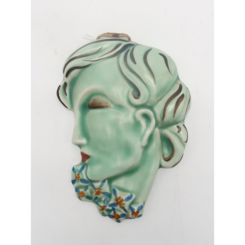 2162 - A CLARICE CLIFF WALL MASKcirca 1936, moulded as a lady in profile with blue and orange flowers aroun... 