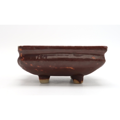 2352 - A CHINESE AUBERGINE GLAZED SQUARE CENSERThe shoulder applied with a pair of animal mask handles, abo... 