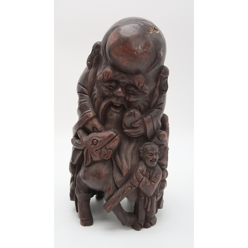 2354 - A CHINESE BAMBOO CARVED FIGURE OF SHOULAOSeated on a reclining deer and with attendant, 31cm high, a... 