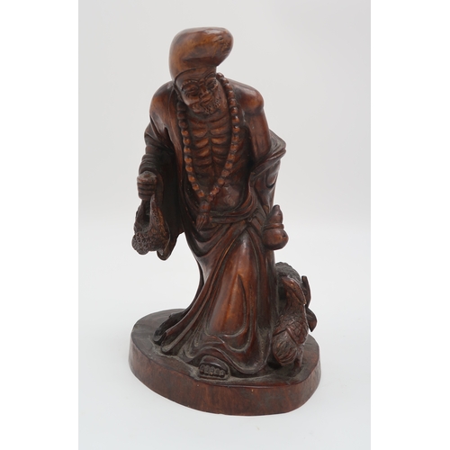 2354 - A CHINESE BAMBOO CARVED FIGURE OF SHOULAOSeated on a reclining deer and with attendant, 31cm high, a... 