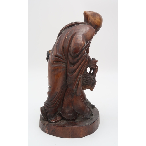 2354 - A CHINESE BAMBOO CARVED FIGURE OF SHOULAOSeated on a reclining deer and with attendant, 31cm high, a... 