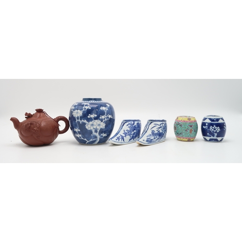 2355 - A YIXING TEAPOT AND COVERWith articulated dragon cover above calligraphy, fish and dragon, 16cm wide... 