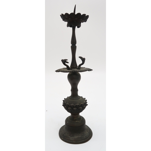 2356 - A CHINESE BRONZE PRICKET CANDLESTICKCast with cranes above a lotus stem, 30cm high, an archaic style... 