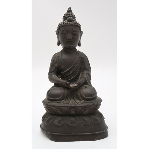 2357 - A CHINESE BRONZE MODEL OF BUDDHACast in typical design on a high lotus throne base, 21.5cm high, a b... 