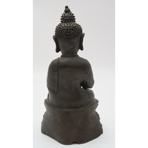 2357 - A CHINESE BRONZE MODEL OF BUDDHACast in typical design on a high lotus throne base, 21.5cm high, a b... 