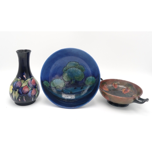 2158 - A COLLECTION OF MOORCROFT POTTERYincluding a Moonlit Blue bowl, 26cm diameter, a flambe leaf pattern... 