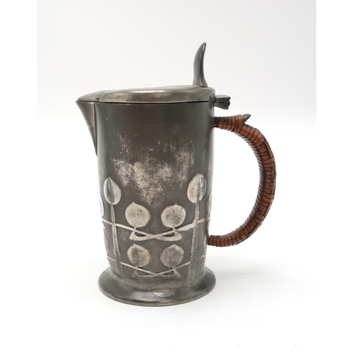 2172 - ARCHIBALD KNOX (1864-1933) DESIGN HOT WATER JUGwith stylised decoration and wicker handle, the base ... 