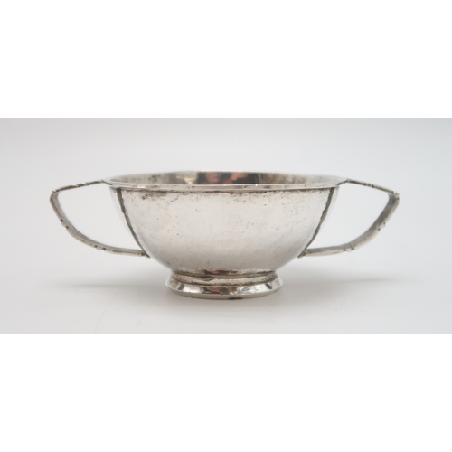 2458 - JOHN FINLAYSON LANG;A Scottish Arts and Crafts style silver twin-handled bowl, Edinburgh 1945, of si... 